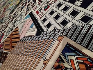 A shopfront stacked with printed sheets, books and wooden crates