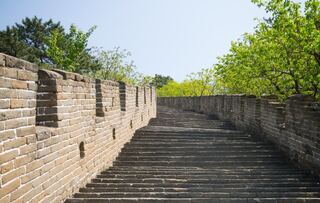Stone steps climbing between the walls of the Great Wall